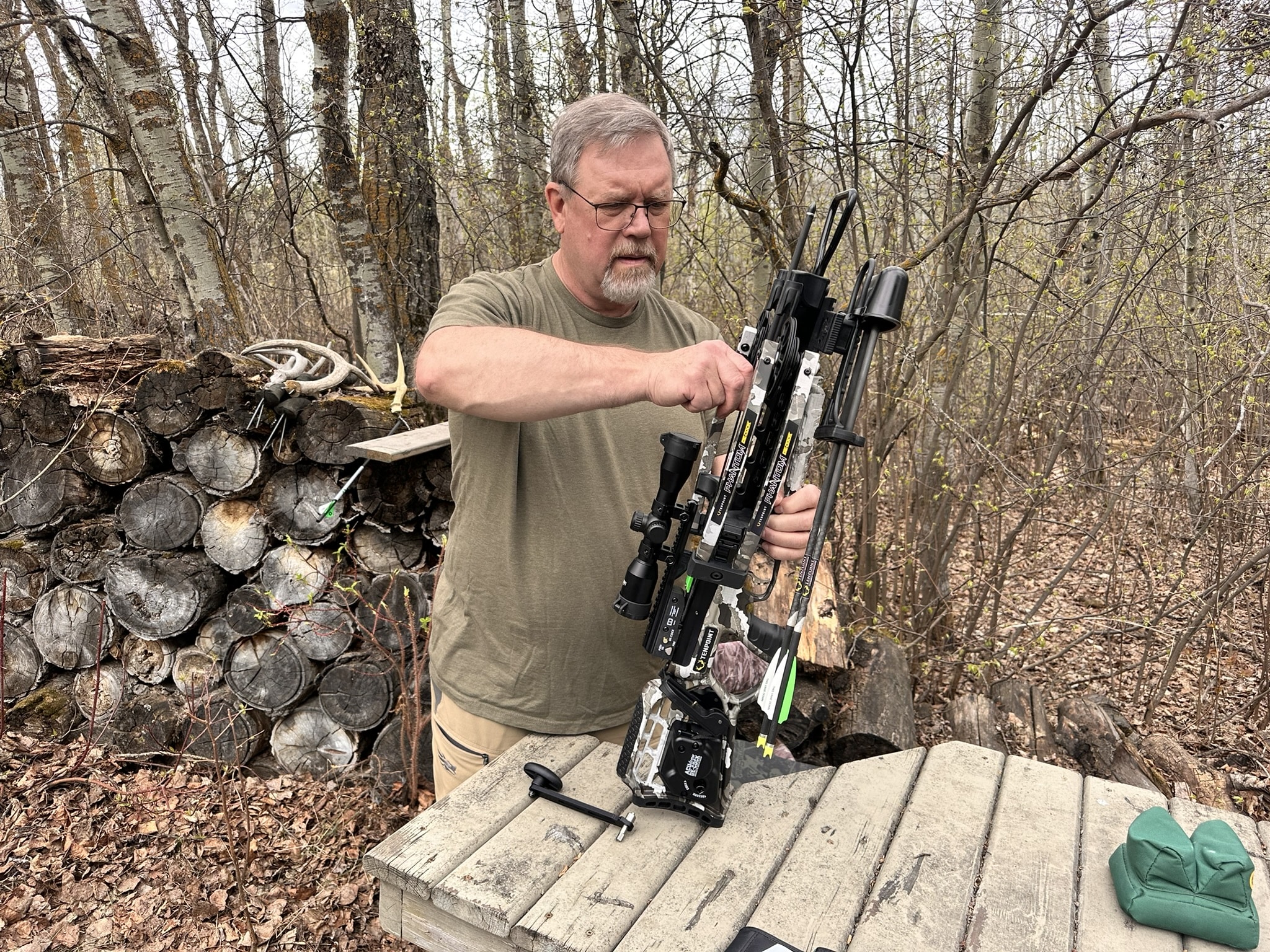 Brad Fenson shooting a crossbow