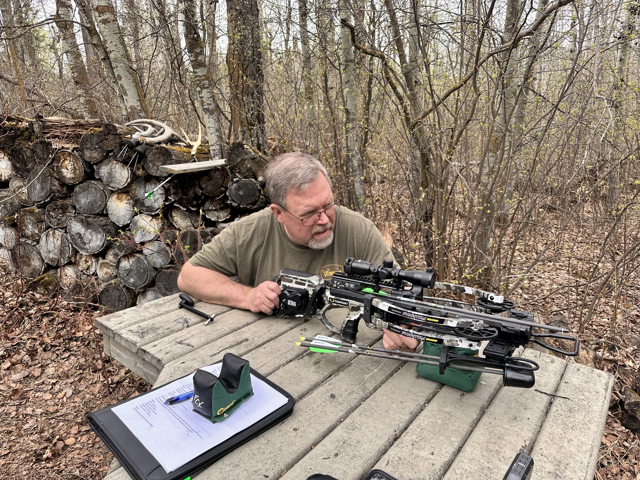 Brad Fenson shooting a crossbow