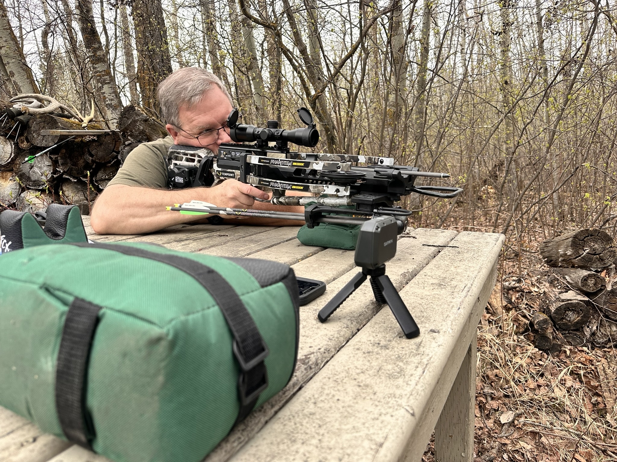 Brad Fenson shooting a crossbow