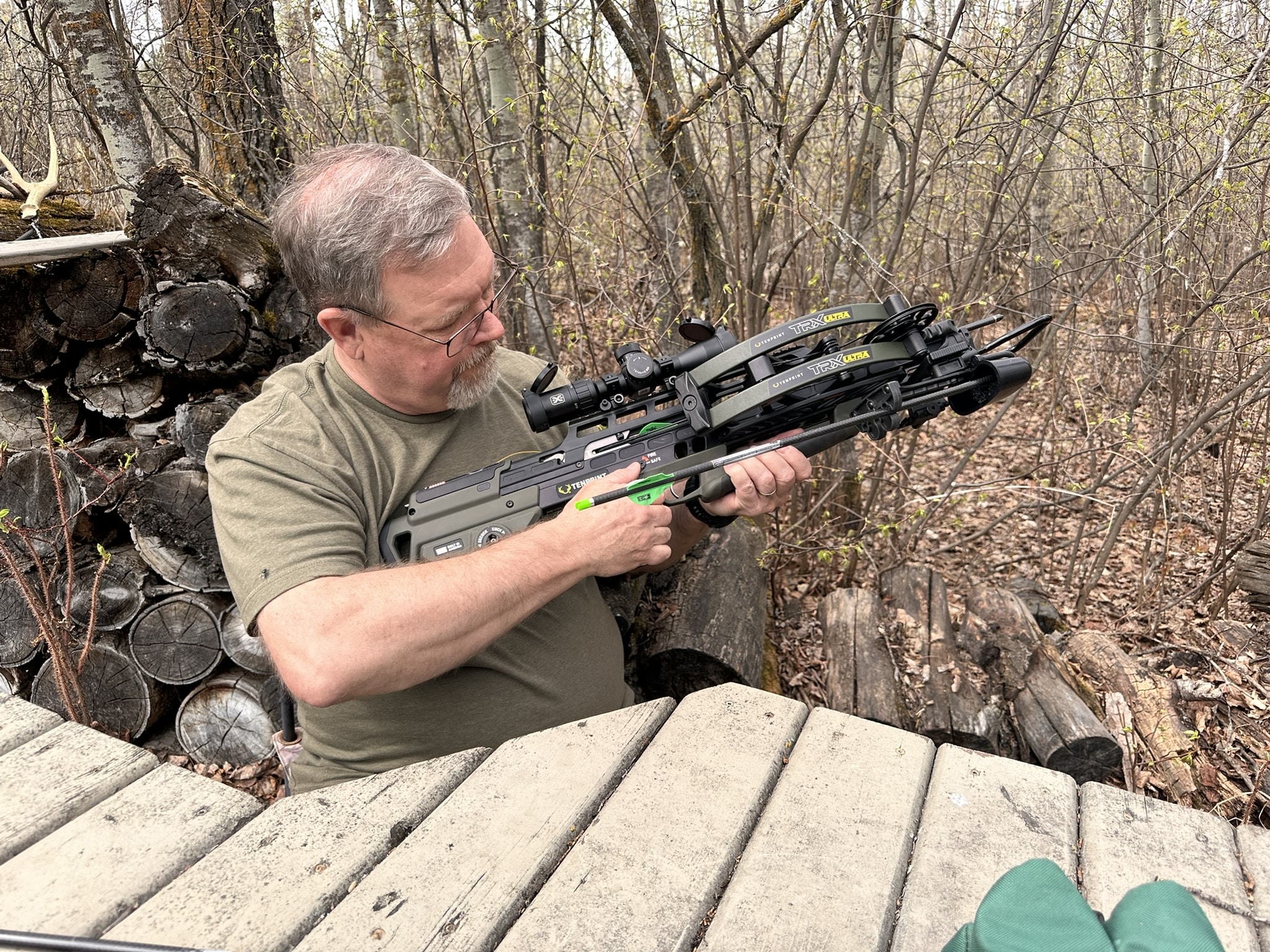 Brad Fenson shooting a crossbow