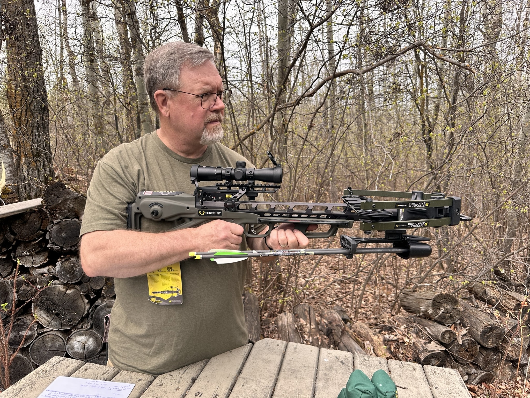 Brad Fenson shooting a crossbow